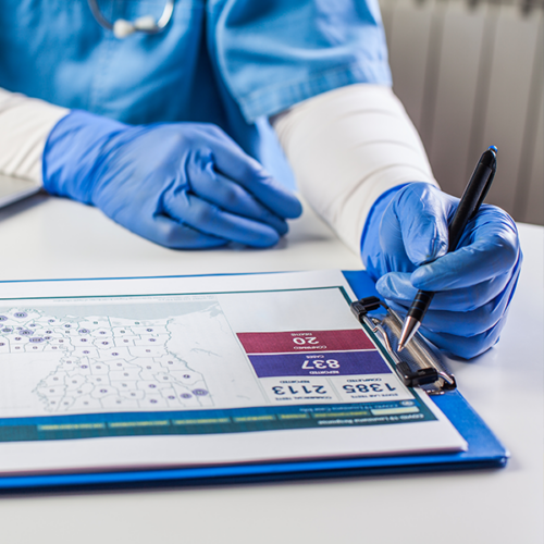 Clinician reviewing health information on a clipboard.