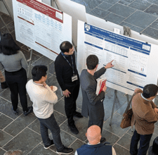 Research Day attendees look at a poster exhibition at the 2024 Research Day.